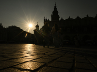 KRAKOW, POLAND - AUGUST 28:
A beautiful sunset and clear blue sky over Krakow's UNESCO Market Square, as Southern Poland and Krakow experien...