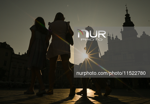 KRAKOW, POLAND - AUGUST 28:
A beautiful sunset and clear blue sky over Krakow's UNESCO Market Square, as Southern Poland and Krakow experien...