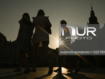 KRAKOW, POLAND - AUGUST 28:
A beautiful sunset and clear blue sky over Krakow's UNESCO Market Square, as Southern Poland and Krakow experien...