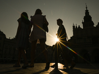 KRAKOW, POLAND - AUGUST 28:
A beautiful sunset and clear blue sky over Krakow's UNESCO Market Square, as Southern Poland and Krakow experien...