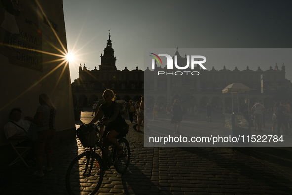 KRAKOW, POLAND - AUGUST 28:
A beautiful sunset and clear blue sky over Krakow's UNESCO Market Square, as Southern Poland and Krakow experien...