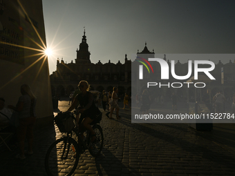 KRAKOW, POLAND - AUGUST 28:
A beautiful sunset and clear blue sky over Krakow's UNESCO Market Square, as Southern Poland and Krakow experien...