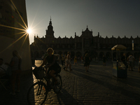 KRAKOW, POLAND - AUGUST 28:
A beautiful sunset and clear blue sky over Krakow's UNESCO Market Square, as Southern Poland and Krakow experien...