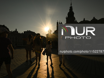 KRAKOW, POLAND - AUGUST 28:
A beautiful sunset and clear blue sky over Krakow's UNESCO Market Square, as Southern Poland and Krakow experien...