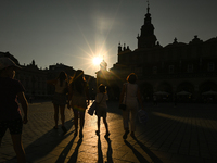 KRAKOW, POLAND - AUGUST 28:
A beautiful sunset and clear blue sky over Krakow's UNESCO Market Square, as Southern Poland and Krakow experien...