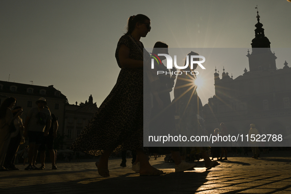 KRAKOW, POLAND - AUGUST 28:
A beautiful sunset and clear blue sky over Krakow's UNESCO Market Square, as Southern Poland and Krakow experien...