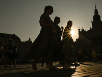 KRAKOW, POLAND - AUGUST 28:
A beautiful sunset and clear blue sky over Krakow's UNESCO Market Square, as Southern Poland and Krakow experien...