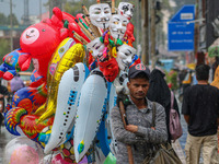 A man sells balloons as it rains in Srinagar, Jammu and Kashmir, on August 29, 2024. (