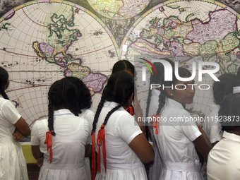 Sri Lankan school children watch a replica World Map by Johannes van Loon in Negombo, Sri Lanka, on August 29, 2024. Johannes van Loon (circ...