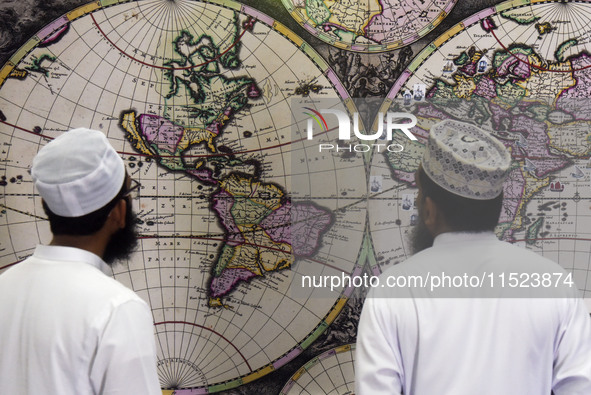 Sri Lankan Muslims watch a replica World Map by Johannes van Loon in Negombo, Sri Lanka, on August 29, 2024. Johannes van Loon (circa 1611-1...