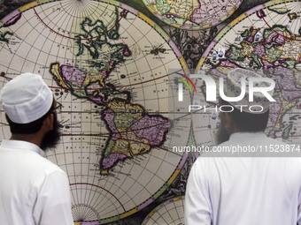 Sri Lankan Muslims watch a replica World Map by Johannes van Loon in Negombo, Sri Lanka, on August 29, 2024. Johannes van Loon (circa 1611-1...