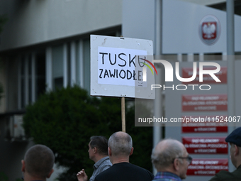 KRAKOW, POLAND - AUGUST 28:
An activist holds a placard reading 'Tusk, you have failed' as members of the KOD (Committee for the Defense of...