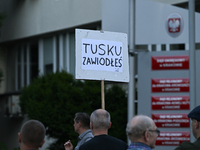 KRAKOW, POLAND - AUGUST 28:
An activist holds a placard reading 'Tusk, you have failed' as members of the KOD (Committee for the Defense of...