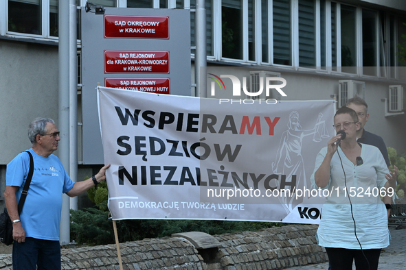 KRAKOW, POLAND - AUGUST 28:
Activists hold a placard reading 'We support independent judges' as members of the KOD (Committee for the Defens...