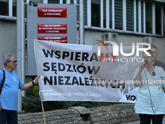 KRAKOW, POLAND - AUGUST 28:
Activists hold a placard reading 'We support independent judges' as members of the KOD (Committee for the Defens...