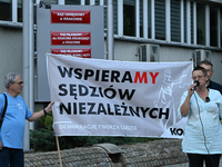 KRAKOW, POLAND - AUGUST 28:
Activists hold a placard reading 'We support independent judges' as members of the KOD (Committee for the Defens...