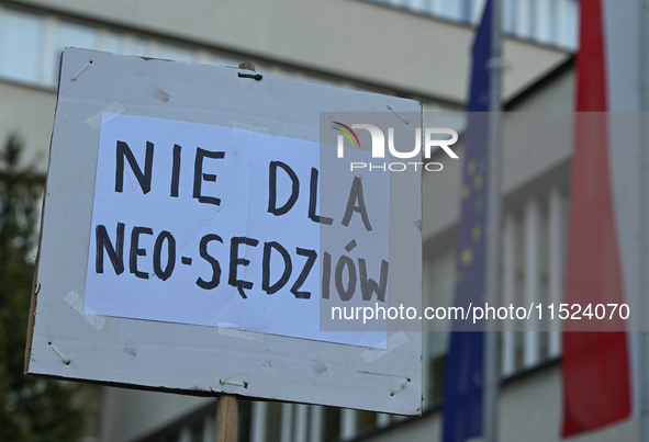 KRAKOW, POLAND - AUGUST 28:
Activists hold a placard reading 'No to Neo-Judges' as members of the KOD (Committee for the Defense of Democrac...