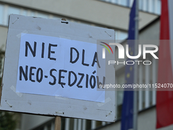 KRAKOW, POLAND - AUGUST 28:
Activists hold a placard reading 'No to Neo-Judges' as members of the KOD (Committee for the Defense of Democrac...