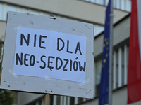 KRAKOW, POLAND - AUGUST 28:
Activists hold a placard reading 'No to Neo-Judges' as members of the KOD (Committee for the Defense of Democrac...