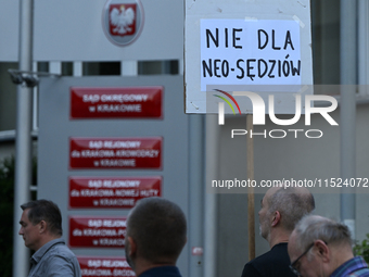 KRAKOW, POLAND - AUGUST 28:
reading 'Tusk, you have failed' as members of the KOD (Committee for the Defense of Democracy) protest outside t...