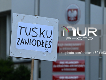 KRAKOW, POLAND - AUGUST 28:
An activist holds a placard reading 'Tusk, you have failed' as members of the KOD (Committee for the Defense of...