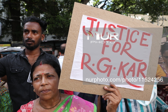 Women participate in ''Journey of Commitment'' during a protest march against the rape and murder of a PGT woman doctor at Government-run R...