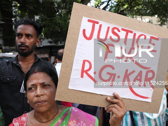 Women participate in ''Journey of Commitment'' during a protest march against the rape and murder of a PGT woman doctor at Government-run R...