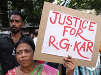 Women participate in ''Journey of Commitment'' during a protest march against the rape and murder of a PGT woman doctor at Government-run R...