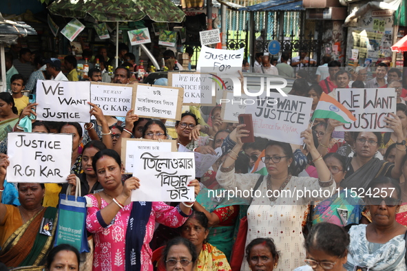 Women participate in ''Journey of Commitment'' during a protest march against the rape and murder of a PGT woman doctor at Government-run R...