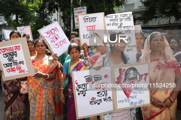 Women participate in ''Journey of Commitment'' during a protest march against the rape and murder of a PGT woman doctor at Government-run R...