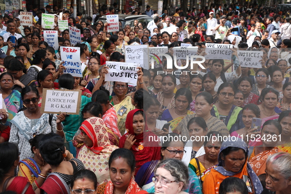 Women participate in ''Journey of Commitment'' during a protest march against the rape and murder of a PGT woman doctor at Government-run R...