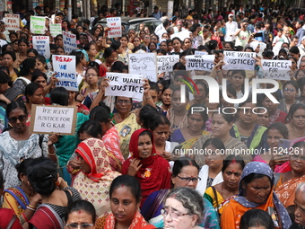 Women participate in ''Journey of Commitment'' during a protest march against the rape and murder of a PGT woman doctor at Government-run R...