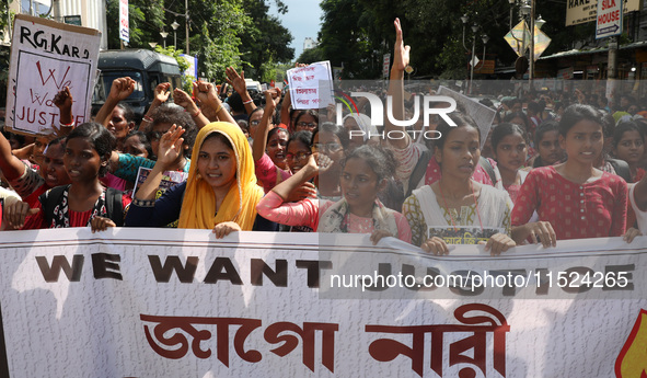 Women participate in ''Journey of Commitment'' during a protest march against the rape and murder of a PGT woman doctor at Government-run R...