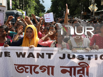 Women participate in ''Journey of Commitment'' during a protest march against the rape and murder of a PGT woman doctor at Government-run R...