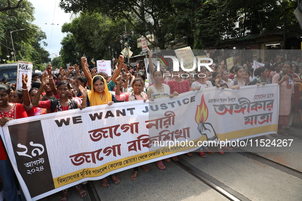 Women participate in ''Journey of Commitment'' during a protest march against the rape and murder of a PGT woman doctor at Government-run R...