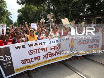 Women participate in ''Journey of Commitment'' during a protest march against the rape and murder of a PGT woman doctor at Government-run R...