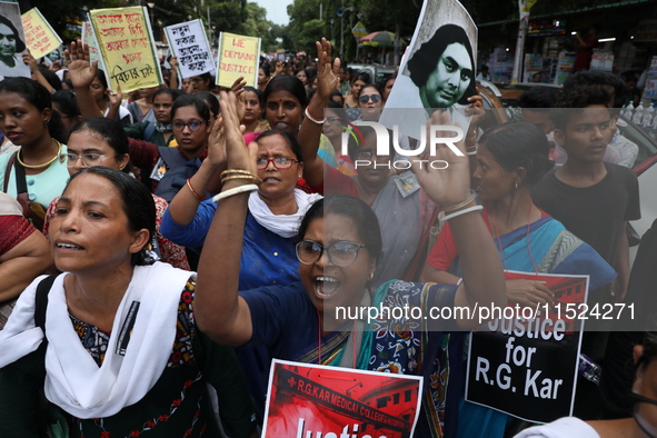 Women participate in ''Journey of Commitment'' during a protest march against the rape and murder of a PGT woman doctor at Government-run R...