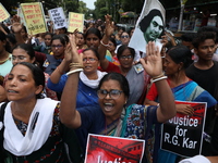 Women participate in ''Journey of Commitment'' during a protest march against the rape and murder of a PGT woman doctor at Government-run R...