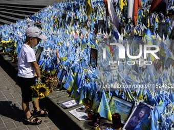 Ukrainians honor the memory of fallen soldiers on the Day of Remembrance of Ukraine's Defenders, amid Russia's attack on Ukraine, at Indepen...