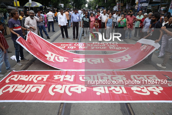 Citizens participate in ''Claim the Way'' during a protest rally against the rape and murder of a PGT woman doctor at Government-run R G Kar...