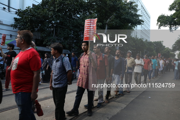 Citizens participate in ''Claim the Way'' during a protest rally against the rape and murder of a PGT woman doctor at Government-run R G Kar...