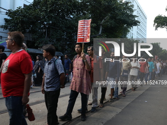 Citizens participate in ''Claim the Way'' during a protest rally against the rape and murder of a PGT woman doctor at Government-run R G Kar...