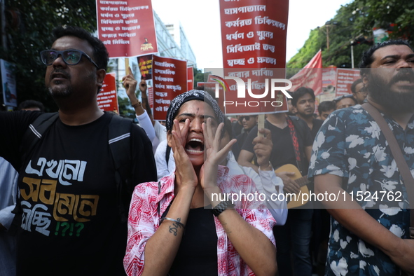 Citizens participate in ''Claim the Way'' during a protest rally against the rape and murder of a PGT woman doctor at Government-run R G Kar...