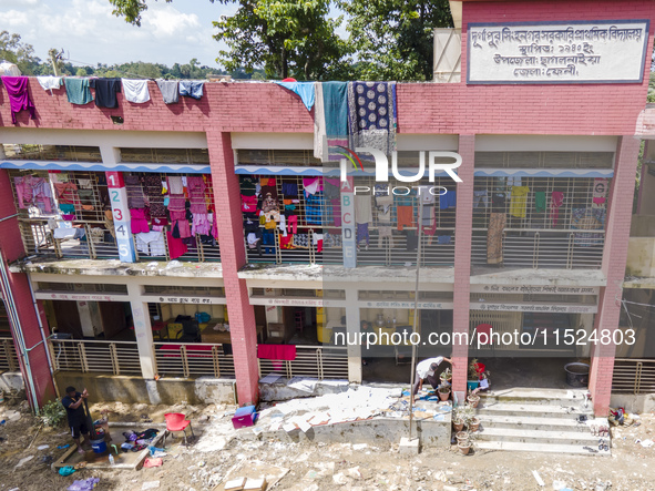 Hundreds of families leave their homes to take shelter in a school in Chagalnaia upazila of Feni district of Chittagong division of Banglade...