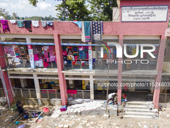 Hundreds of families leave their homes to take shelter in a school in Chagalnaia upazila of Feni district of Chittagong division of Banglade...