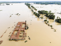 A brickyard and a car are half submerged in flood water in the Chanpur area of Chagalnaia upazila of Feni district of Chittagong division of...