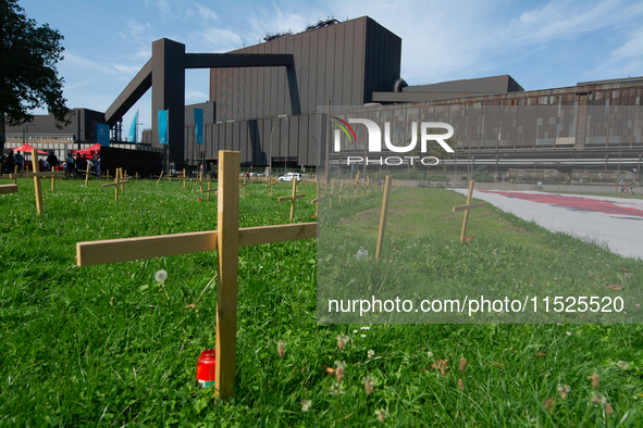 Crosses are placed in front of the headquarters of Thyssenkrupp industrial area in Duisburg, Germany, on August 29, 2024, as the IG Metall u...