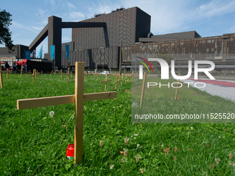 Crosses are placed in front of the headquarters of Thyssenkrupp industrial area in Duisburg, Germany, on August 29, 2024, as the IG Metall u...