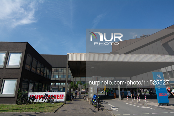 A thousand steel workers stand in front of the gate of the Thyssenkrupp industrial area in Duisburg, Germany, on August 29, 2024, as the IG...