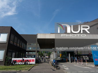 A thousand steel workers stand in front of the gate of the Thyssenkrupp industrial area in Duisburg, Germany, on August 29, 2024, as the IG...